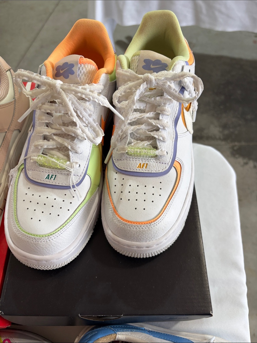 Nike White Sneakers with Pastel Orange, Green & Lavender Accents